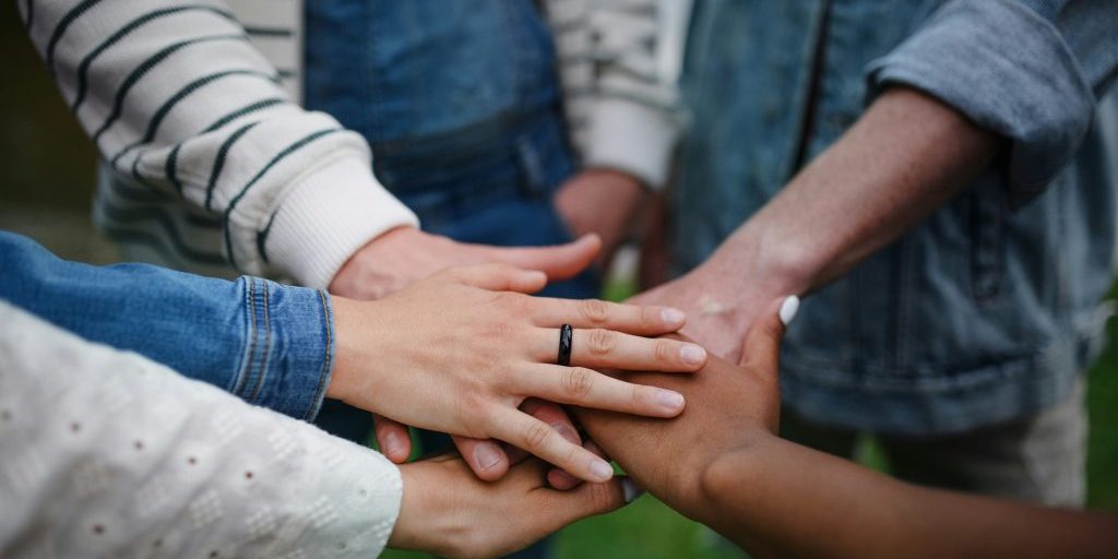 Hands joining in a circle
