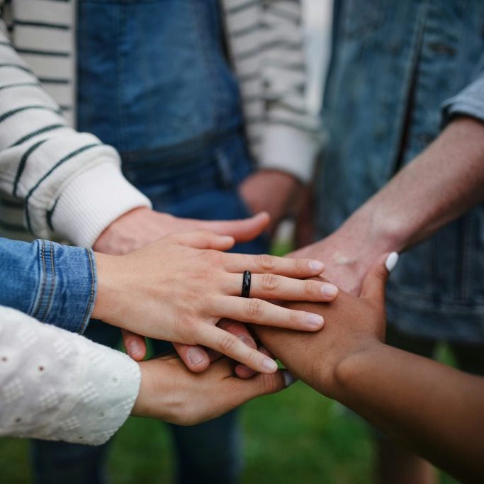 Hands joining in a circle