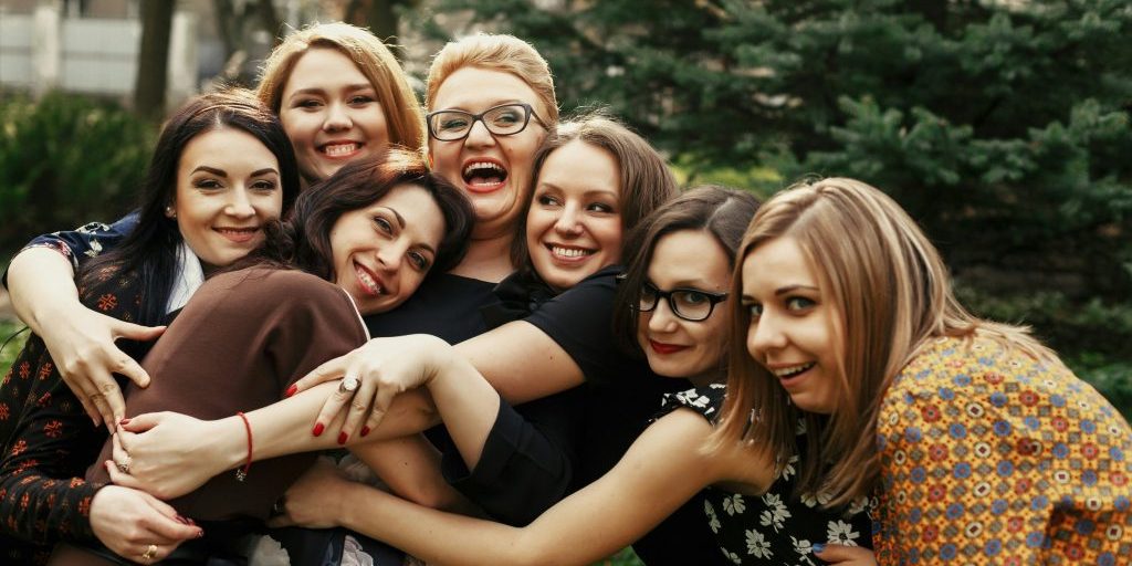 Group of friends hugging.
