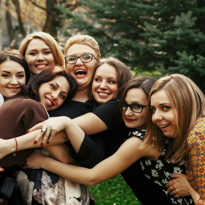 Group of friends hugging.